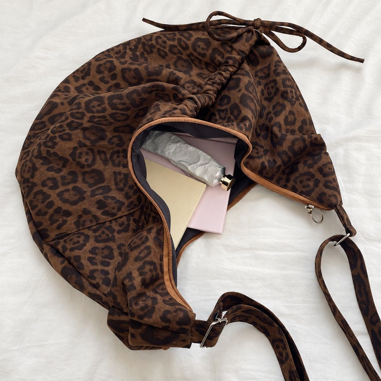 Leopard Print Suede Look Crescent Hobo Shoulder Bag with Zip Closure and Exterior Pocket