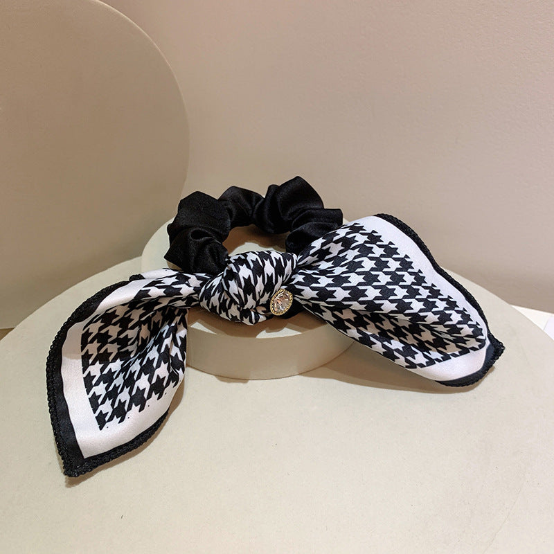 Scrunchy with a Houndstooth Patterned Silky Bow