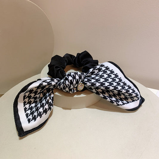 Scrunchy with a Houndstooth Patterned Silky Bow