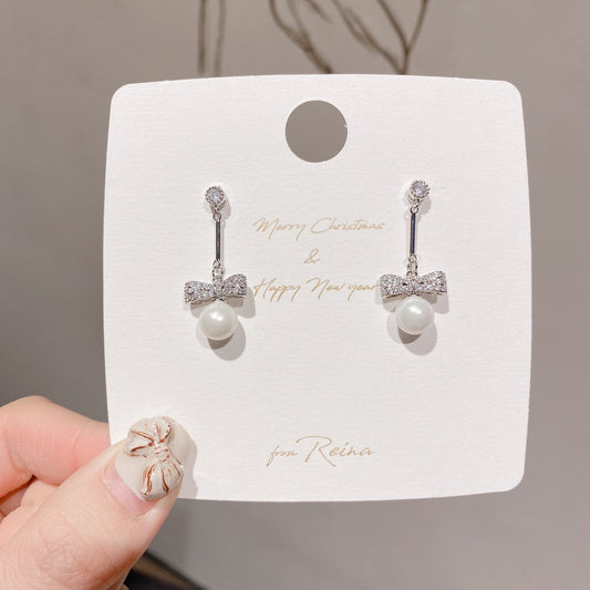 Pearl and Bow Silver Dangle Earring