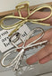 Metallic Bow Design Hair Claw