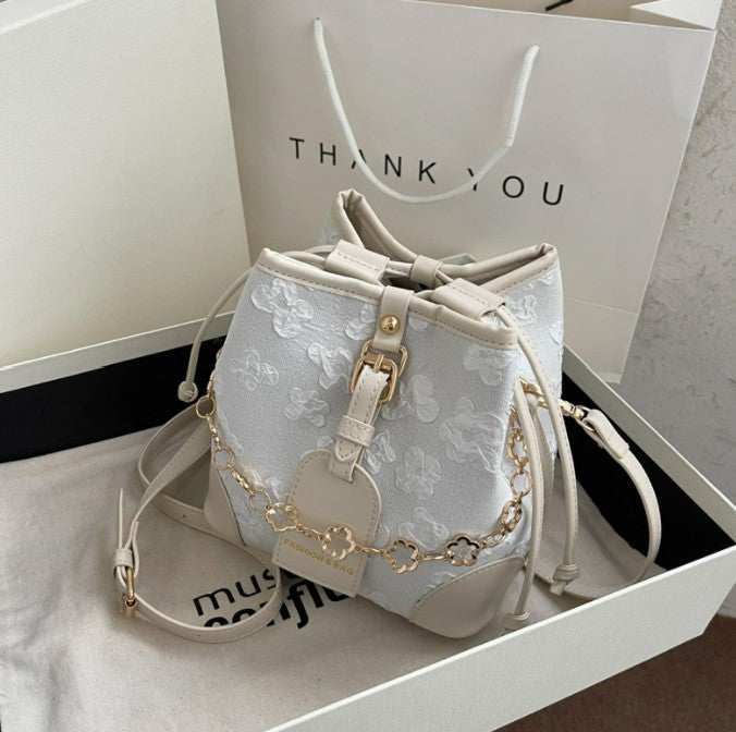 Flower Embossed Bucket Bag with Drawstrings